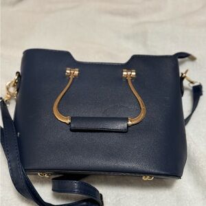 Elegant Navy Blue Handbag with Gold Accents